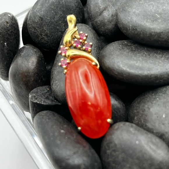 Gold wrapped carnelian pendant with small pinkish rubies adorn the top. - Picture 1 of 3